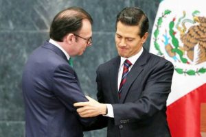 Mexico's President Enrique Pena Nieto shakes hands with Mexico's former Finance Minister Luis Videgaray during the announce of new cabinet members at Los Pinos presidential residence in Mexico City